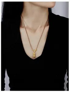Chic Chinese style gold plated vajra pestle pendant necklace with brown cord, detail view.