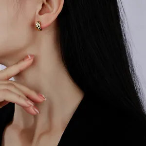 Minimalist gold metal twisted hoop earrings for women, trendy geometric small huggie earrings.