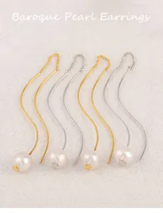 Pendientes largos de perlas barrocas con elegante diseño en forma de S y dijes de perlas encantadores.