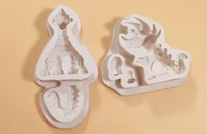 Silicone dinosaur mold details showing texture, close-up view of cute cartoon fondant baking tools.