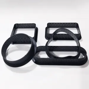 Set of black perforated baking rings for DIY tarts, cakes, and cookies pastry making.