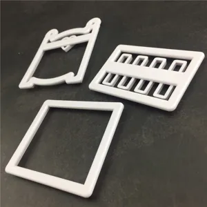 White plastic baby cot cookie cutter set fondant baking mold detail view showing 3 pieces.