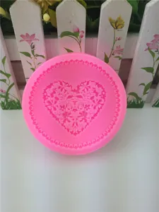 Pink silicone heart lace mold for baking, chocolate, fondant, clay, and epoxy craft projects.