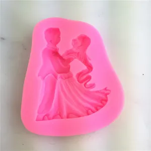 Pink silicone mold featuring a dancing bride and groom design for DIY fondant cake baking tools.