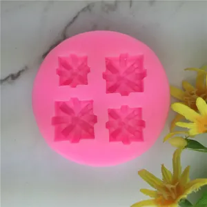 Detailed view of the pink silicone mold with four cavities, perfect for cake baking.