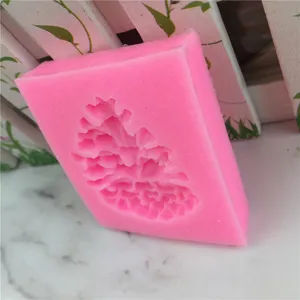 Silicone pine cone fondant mold detail view, pink cake decorating tool for baking use.