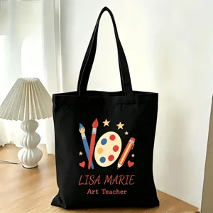 Detailansicht der schwarzen Leinentasche mit personalisiertem Kunstlehrer-Design und Text.