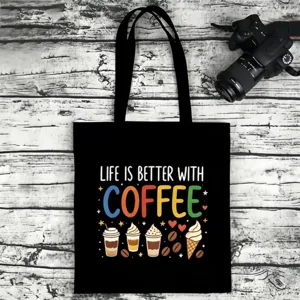 Black canvas tote bag with coffee quote print, durable casual shoulder bag for daily use.