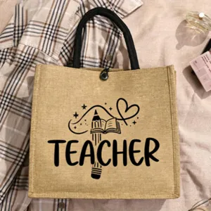 Jute tote bag with teacher letter print and cute pencil book graphic for daily use.
