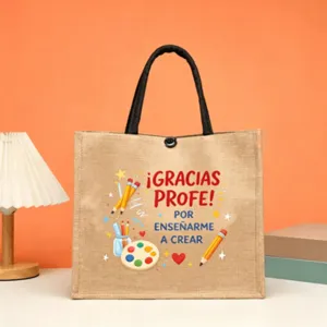 Detalle de bolso de yute con estampado de agradecimiento para profesores y asas negras.