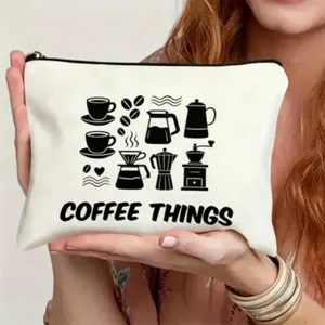 Canvas makeup bag detail featuring coffee theme line art illustration and secure zipper.