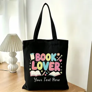 Vista dettagliata della borsa in tela nera con stampa tema libri e testo personalizzabile.