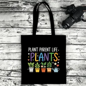 Black canvas tote bag with plant print, casual daily shoulder bag for women and men.