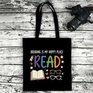 Black canvas tote bag with colorful reading theme print, ideal for teachers and book lovers.