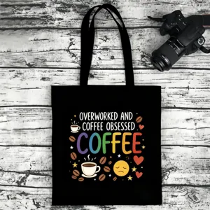 Black canvas tote bag with funny coffee lover graphic print, casual shoulder bag for daily use.