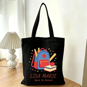 Schwarze Segeltuch Tragetasche Detailansicht mit individuellem Schulmotiv Druck und Henkel.
