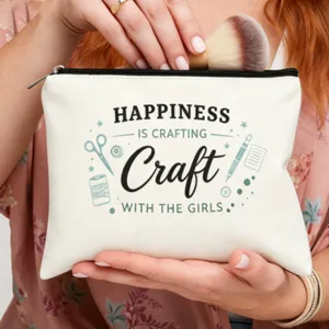 Bolsa de maquillaje de lona con impresión de letras inspiradoras y motivos de manualidades.