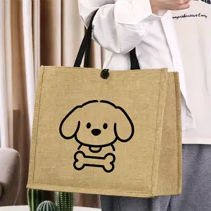 Vintage jute tote bag with cute puppy graphic, casual canvas handbag for daily shopping use.