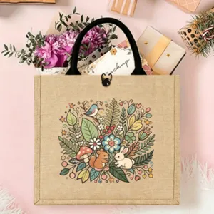Detail view of a Nordic folk jute tote bag with cute animal and floral cartoon print.