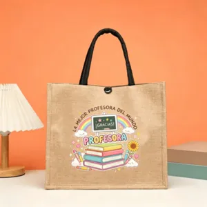 Teacher theme jute tote bag with black handles and colorful print for daily use or gift.