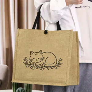 Detailed view of the cute cat line art and premium jute texture on this versatile retro tote bag.