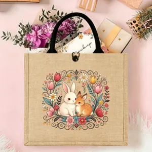 Detailed view of the cute rabbit and floral printed jute tote bag with sturdy handles.