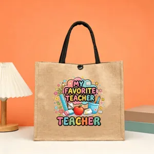 Jute tote bag featuring a cute teacher themed graphic print, perfect daily canvas handbag.