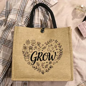 Grosse Jute Tragetasche mit botanischem Herz Druck und inspirierendem Text für den Alltag.