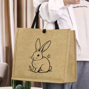 Vintage jute tote bag with cute rabbit line art print, perfect casual linen handbag for daily use.