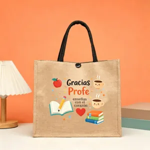 Detailansicht der Jute-Tragetasche zum Lehrertag auf Spanisch mit niedlichem Apfel- und Buch-Druck.