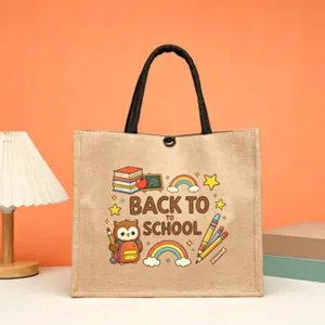 Close-up detail of a cartoon school theme jute tote bag with cute owl and rainbow print.