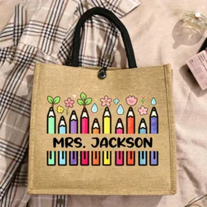 Customizable name teacher jute tote bag with cute colorful pencil pattern for daily shopping use.