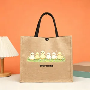 Jute tote bag with cute duck print and custom name, sturdy handles for daily use.