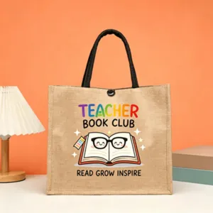Teacher jute tote bag detail featuring colorful book club graphic, eco-friendly burlap shopping bag.
