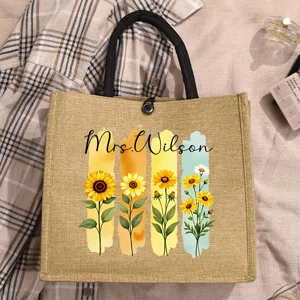 Customized sunflower jute tote bag with black handles, stylish botanical print canvas handbag.