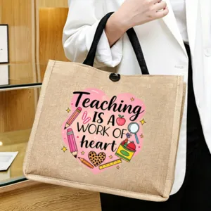 Detailed close-up shot of the Teacher themed jute tote bag showing front print and sturdy handles.
