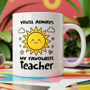 White ceramic coffee mug with cute sun smiling face graphic and teacher appreciation quote.