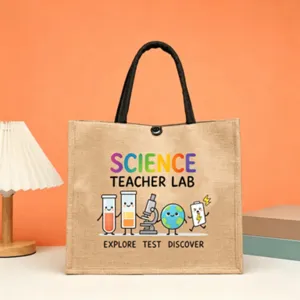 Science teacher jute tote bag detail showing cute cartoon science elements and bright text.
