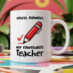 Teacher theme ceramic coffee mug detail shot, white cup with cute red pencil graphic and text.