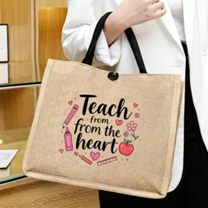 Close-up of the natural jute tote bag featuring cute teacher theme graphic and handles.