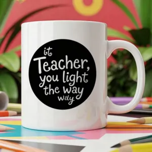 Close-up detail of the white ceramic coffee mug featuring a creative teacher theme text design.