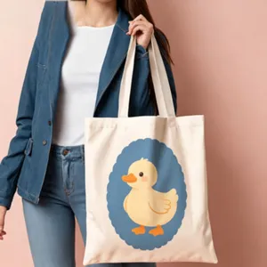 Cute cartoon yellow duck canvas tote bag with blue scalloped frame print for daily use.