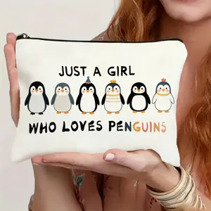 Canvas cosmetic bag with cute penguin print and zipper, ideal for travel and daily storage use.