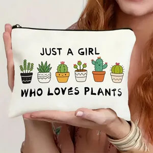 Close-up detail of white canvas zipper pouch featuring cute cactus prints and funny typography.