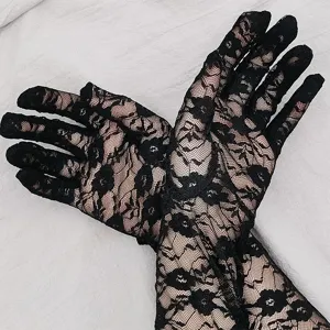 Detailed view of elegant black lace long gloves, perfect for bridal, wedding, and evening parties.