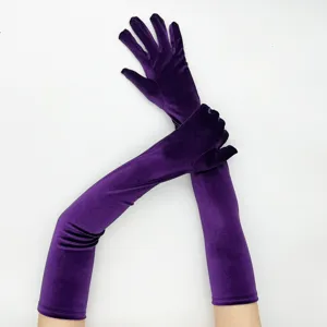 Detailed close-up of long purple velvet opera gloves, showing soft texture and retro style.
