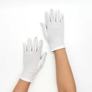Close-up detail view of thin white elastic gloves, soft milk silk fabric for daily wear.