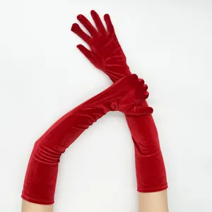 Detailed view of long red velvet opera gloves, elegant vintage style for stage and evening wear.
