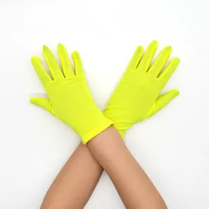 Neon yellow stretch gloves detail shot, showing breathable fabric and elastic wrist design.