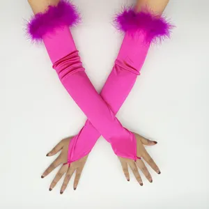 Details of pink satin finger loop gloves with fluffy feather cuffs for retro 1920s party cosplay.